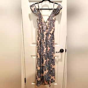 Flowing high-low dress with peek a boo shorts. Size: Small.